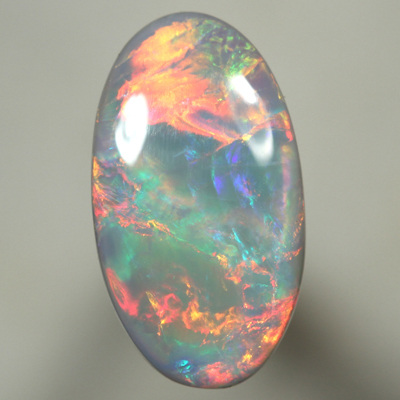 SOLID SEMI BLACK OPAL Top quality. Bright, strong fire in rolling flashes. SEE VIDEO